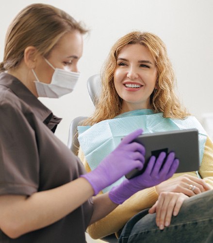 A woman discussing the cost of tooth extraction