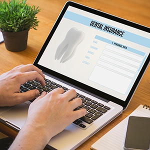 Patient looking at dental information form on computer