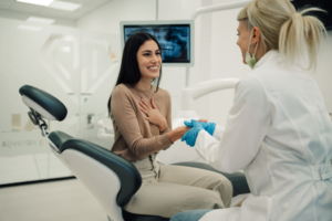 a patient smiling after getting a root canal